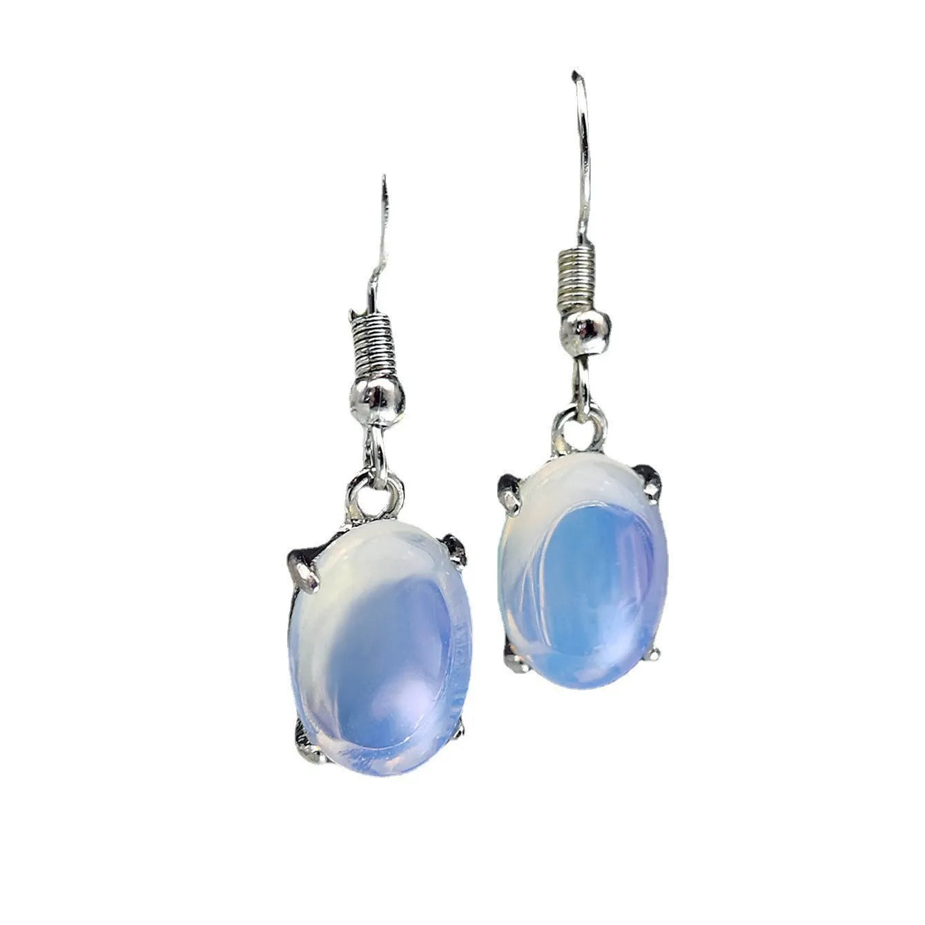 Pair of pale opal-colour drop earrings with a small cross detail on an elliptical alloy pendant.