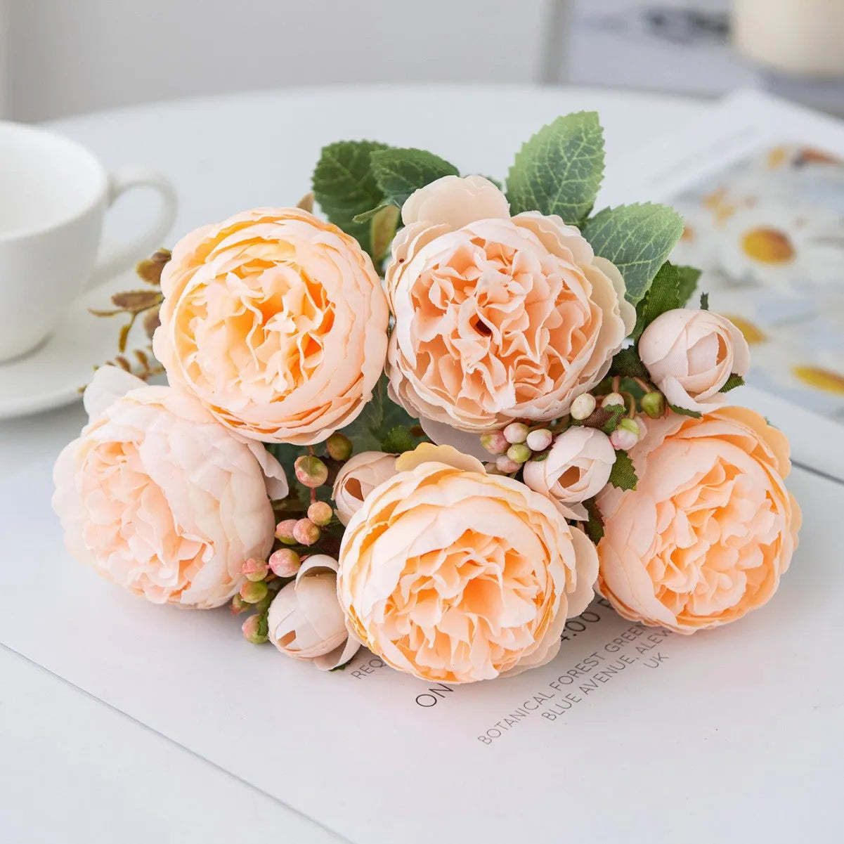 Artificial silk peony bouquet in champagne colour for home or wedding table decoration.
