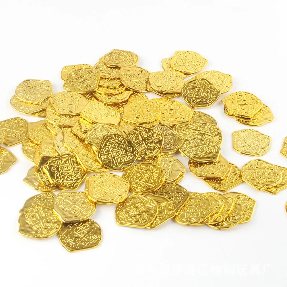 Close-up of gold, silver, and bronze plastic replica Roman pirate coins from a 100-piece set.