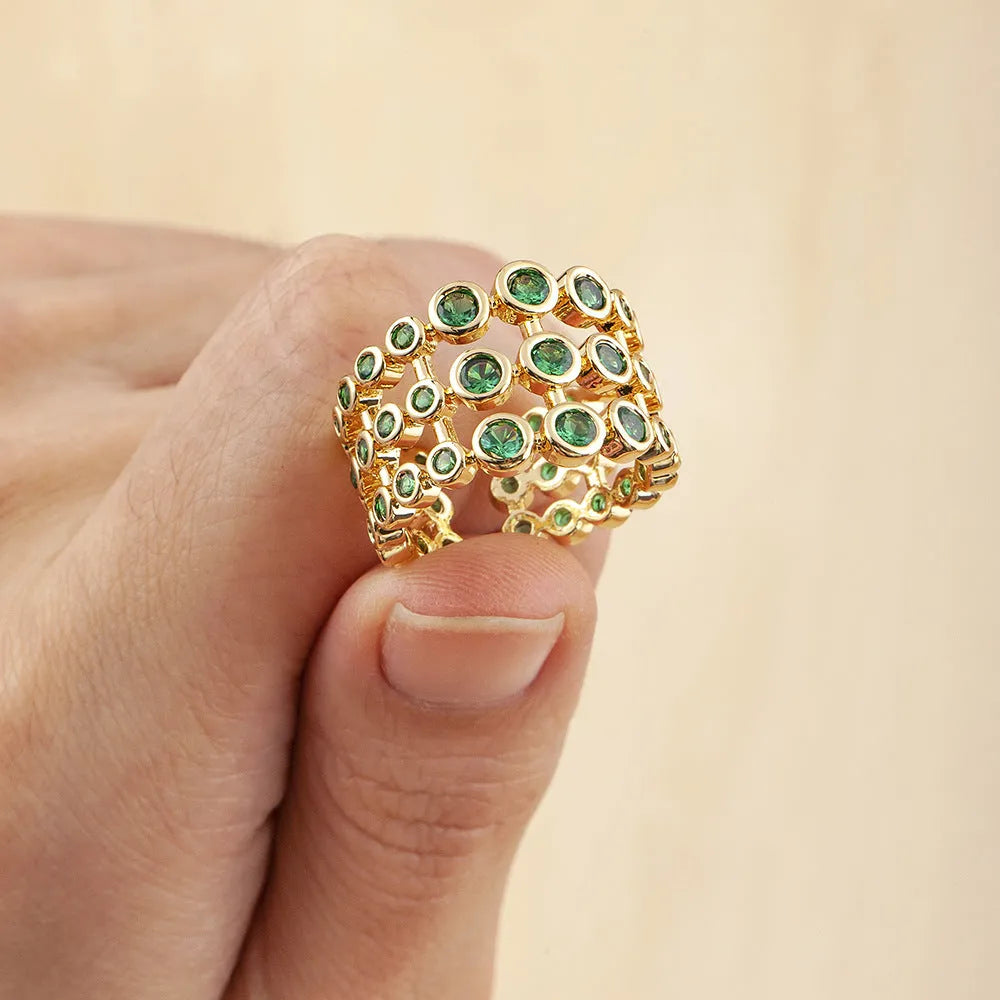 Copper ring with gold plating and green zircon stones in wide band design