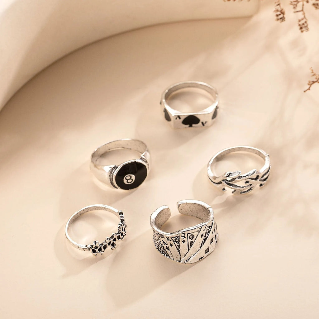 Black alloy poker ring with spade design and adjustable band