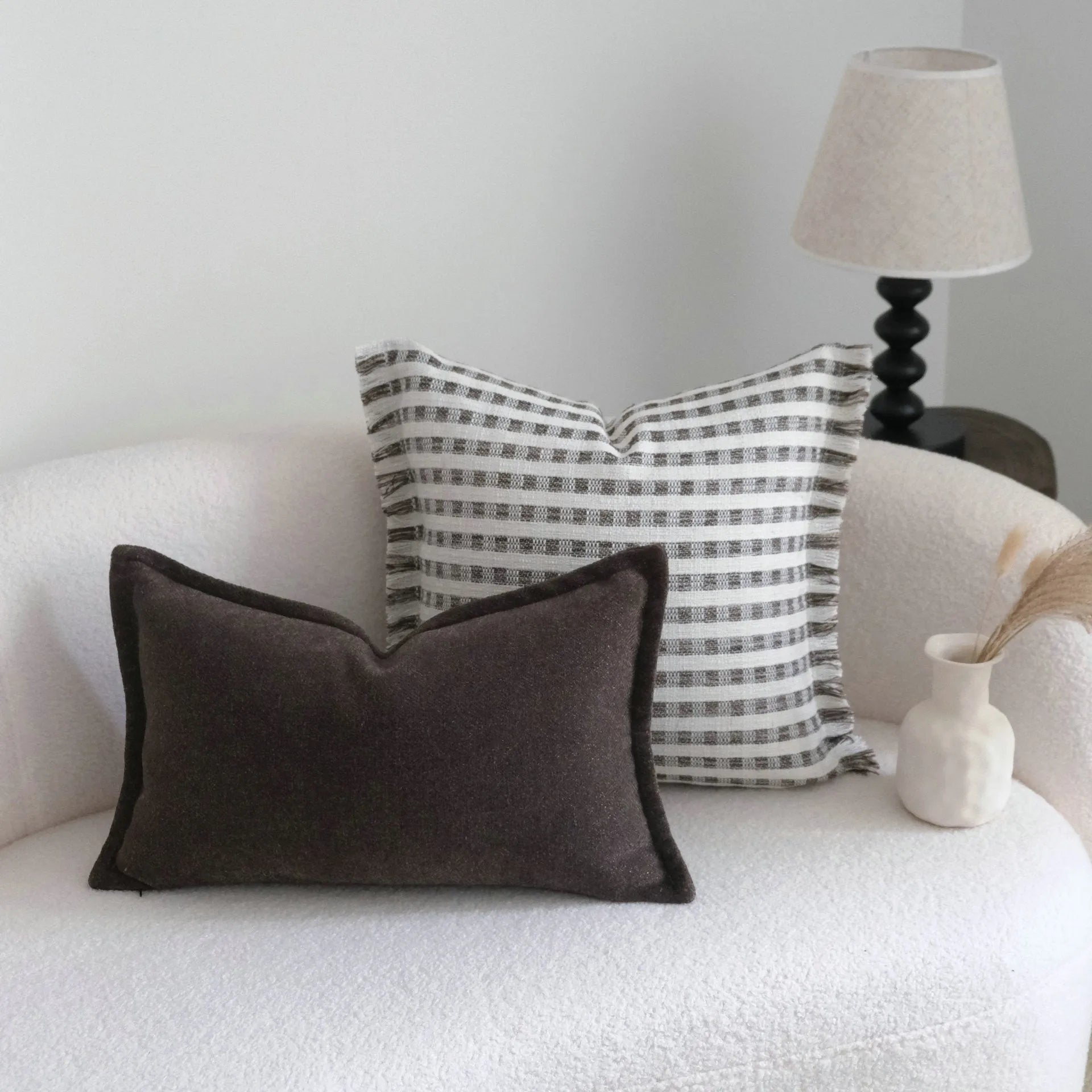 Coffee brown striped Chinese classical style sofa cushion on a living room sofa.