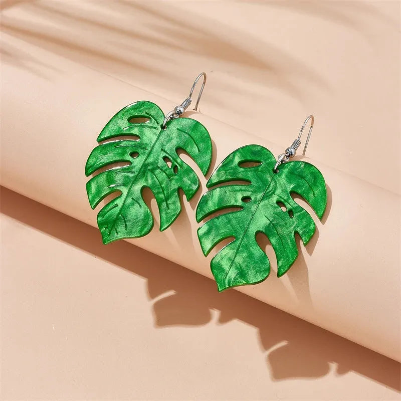 Drop-shaped acrylic earrings with summer coconut design in five colour variations on alloy ear hooks