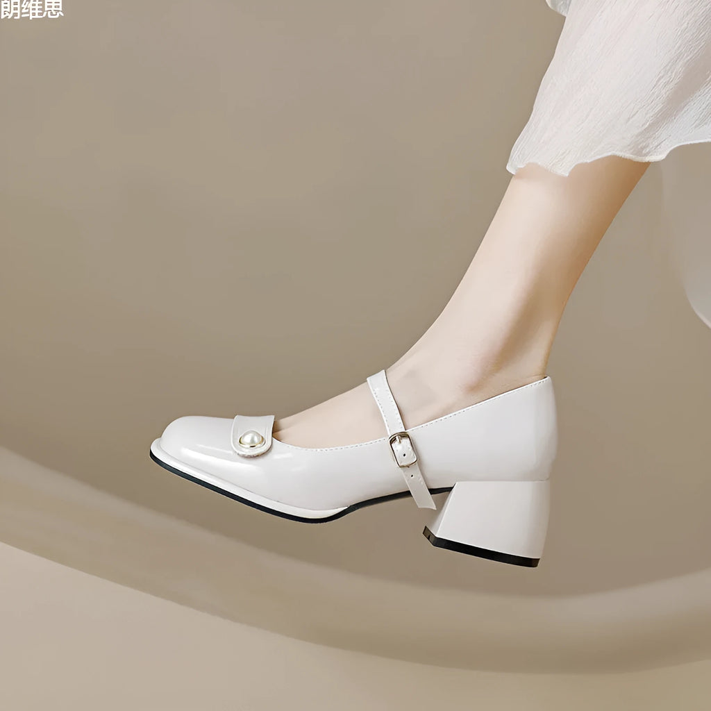 French-style women's chunky heel pumps with patent leather upper and buckle fastening
