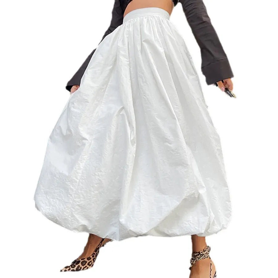 Women's solid colour cotton long skirt with elasticated waistband in black and white.