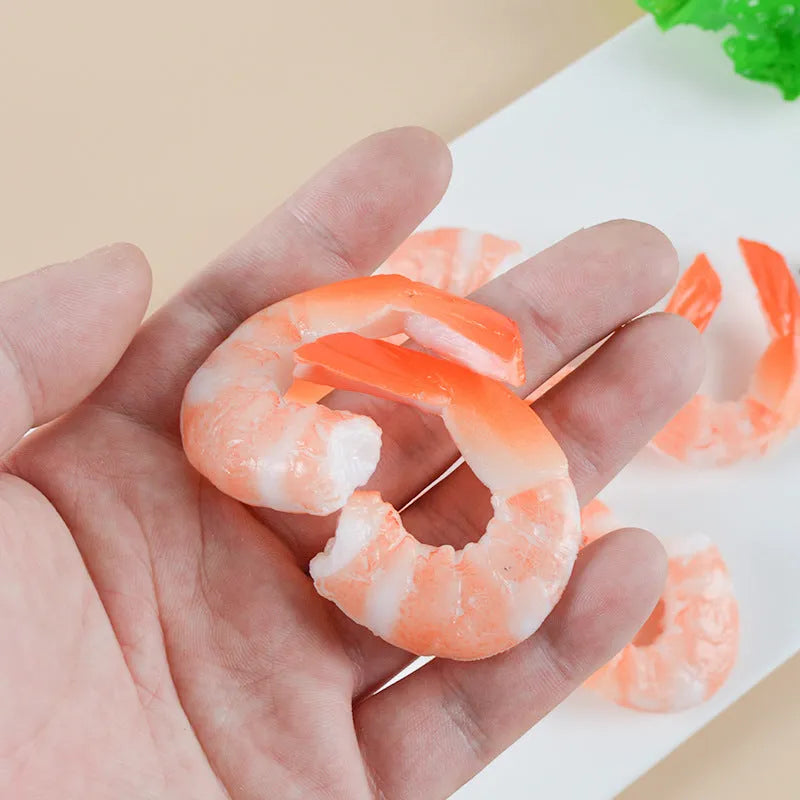 Realistic PVC shrimp-shaped keychain with door buckle attachment on white background.