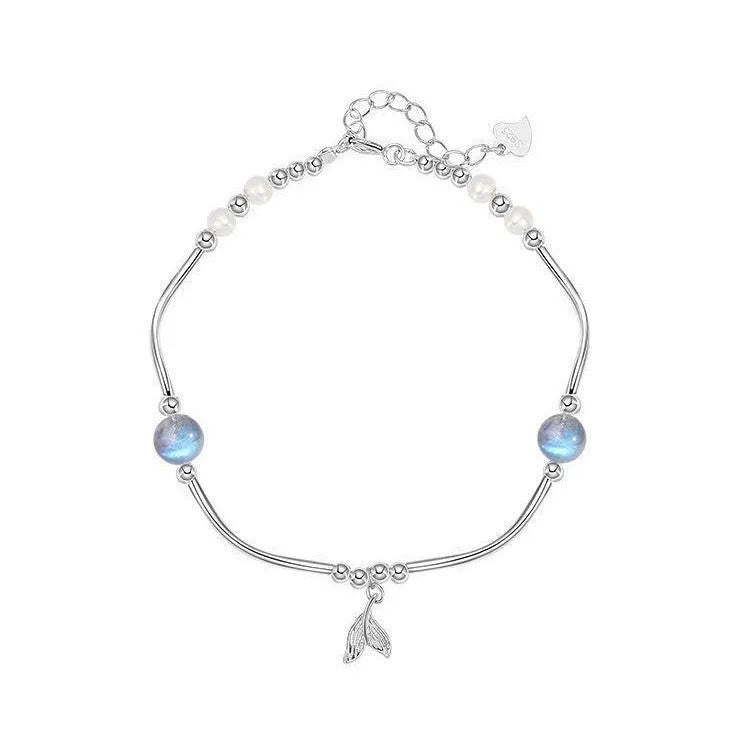 Pearl fishtail bracelet with irregular asymmetric bow in alloy