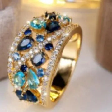 Women's round hollow copper fashion ring showing gold and platinum colour options with gemstone tone finishes