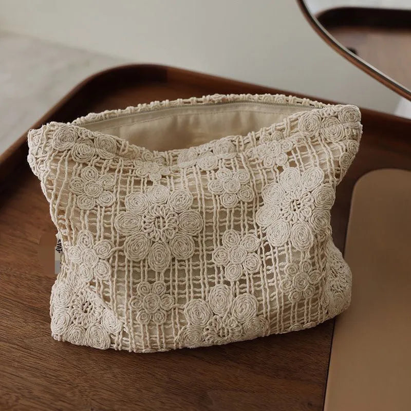 Handmade crocheted cosmetic bag with hollow floral embroidery on corduroy fabric in rope colour