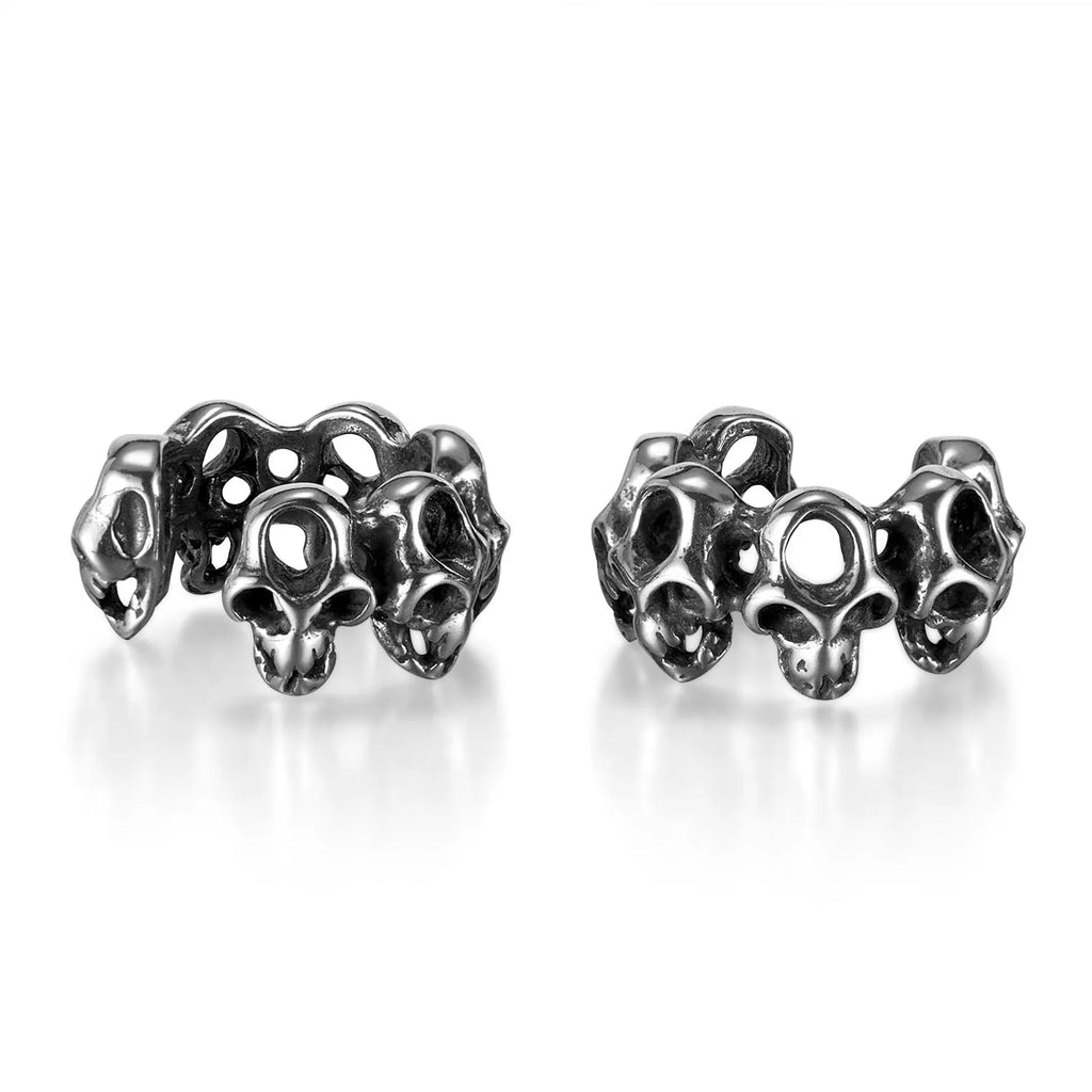 Stainless steel clip-on earrings with hollow geometric skull design in electroplated finish