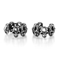 Stainless steel clip-on earrings with hollow geometric skull design in electroplated finish