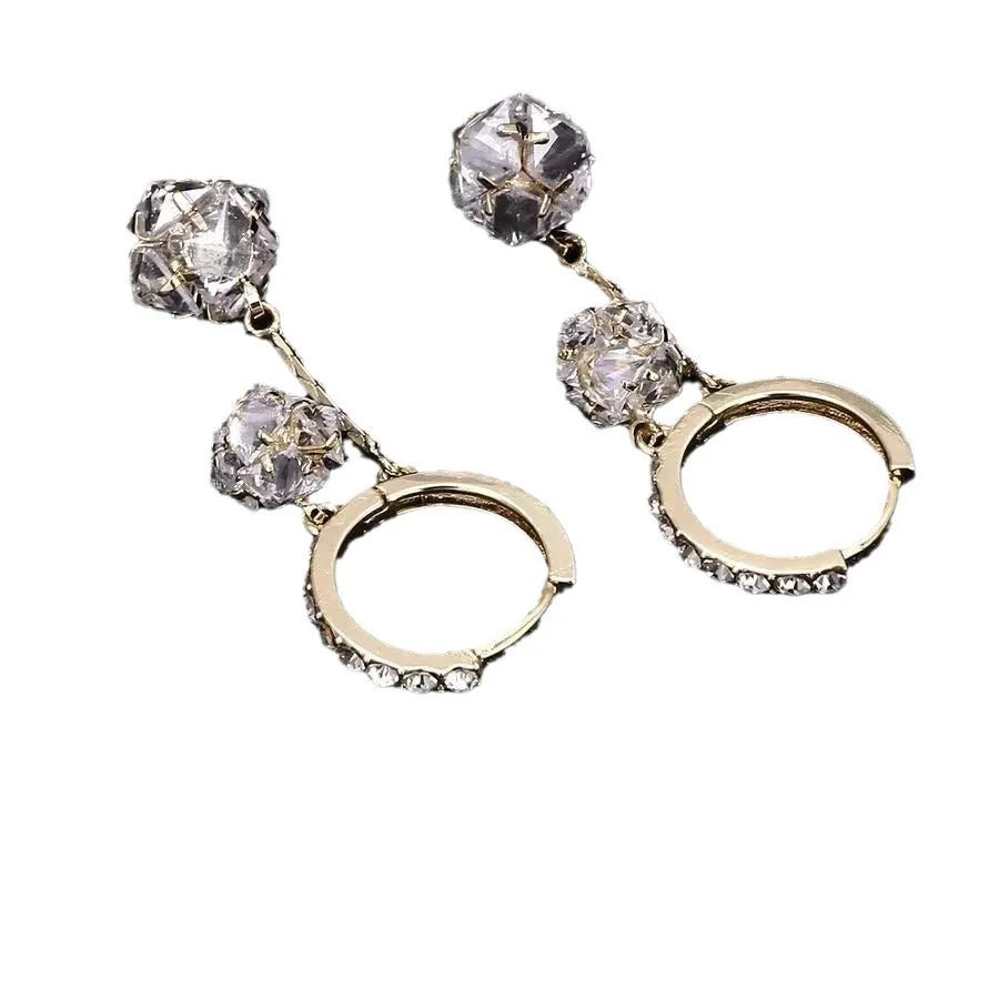 Women's silver drop earrings with tassel ball and rhinestone ball double pendant design, clip-on fastening
