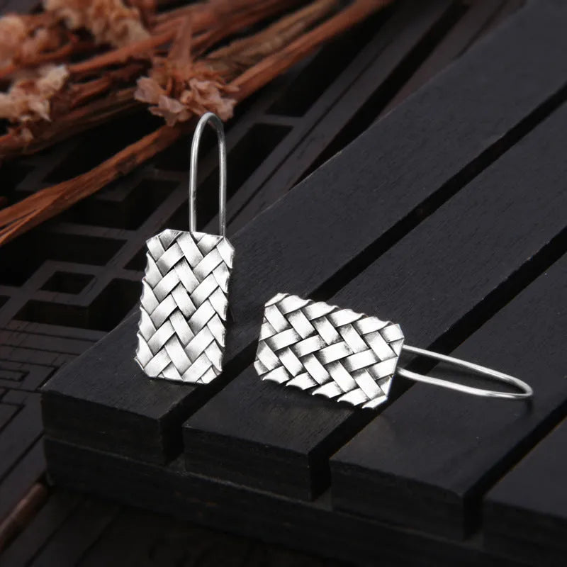 Women's silver 925 sterling silver woven diamond plaid geometric earrings showing textured pattern