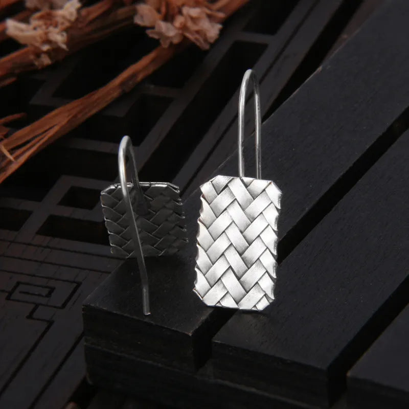 Women's silver 925 sterling silver woven diamond plaid geometric earrings showing textured pattern