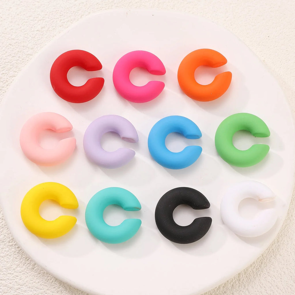 Matte finish C-shaped geometric clip-on earrings in assorted candy colours