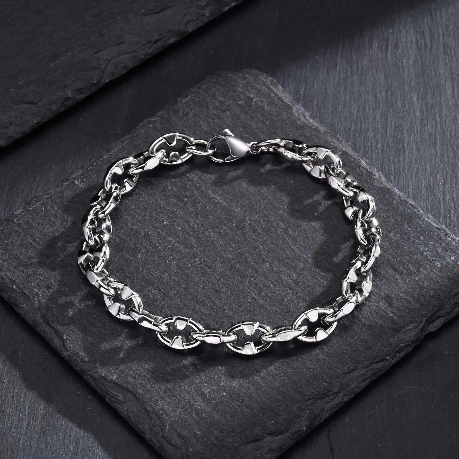 Thick stainless steel geometric chain bracelet for men, shown in steel colour.