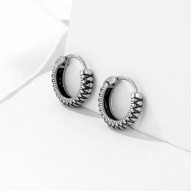 Silver geometric alloy earrings with a retro twist design and stainless steel stripes.