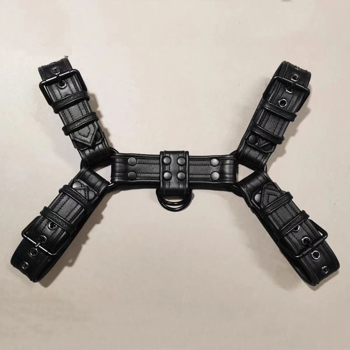 Black leather chest muscle bondage strap with metal buckle adjustment for adult shoulder harness