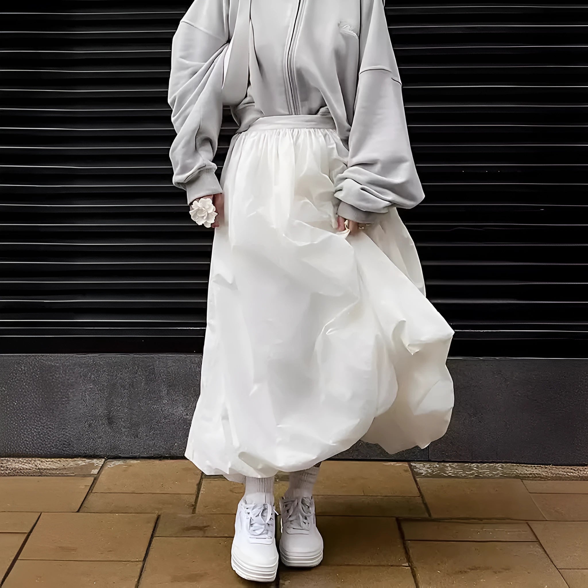 Women's solid colour cotton long skirt with elasticated waistband in black and white.