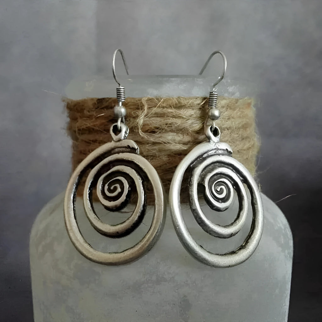 Silver alloy geometric spiral earrings with a distressed finish, measuring 2.6cm by 5cm.