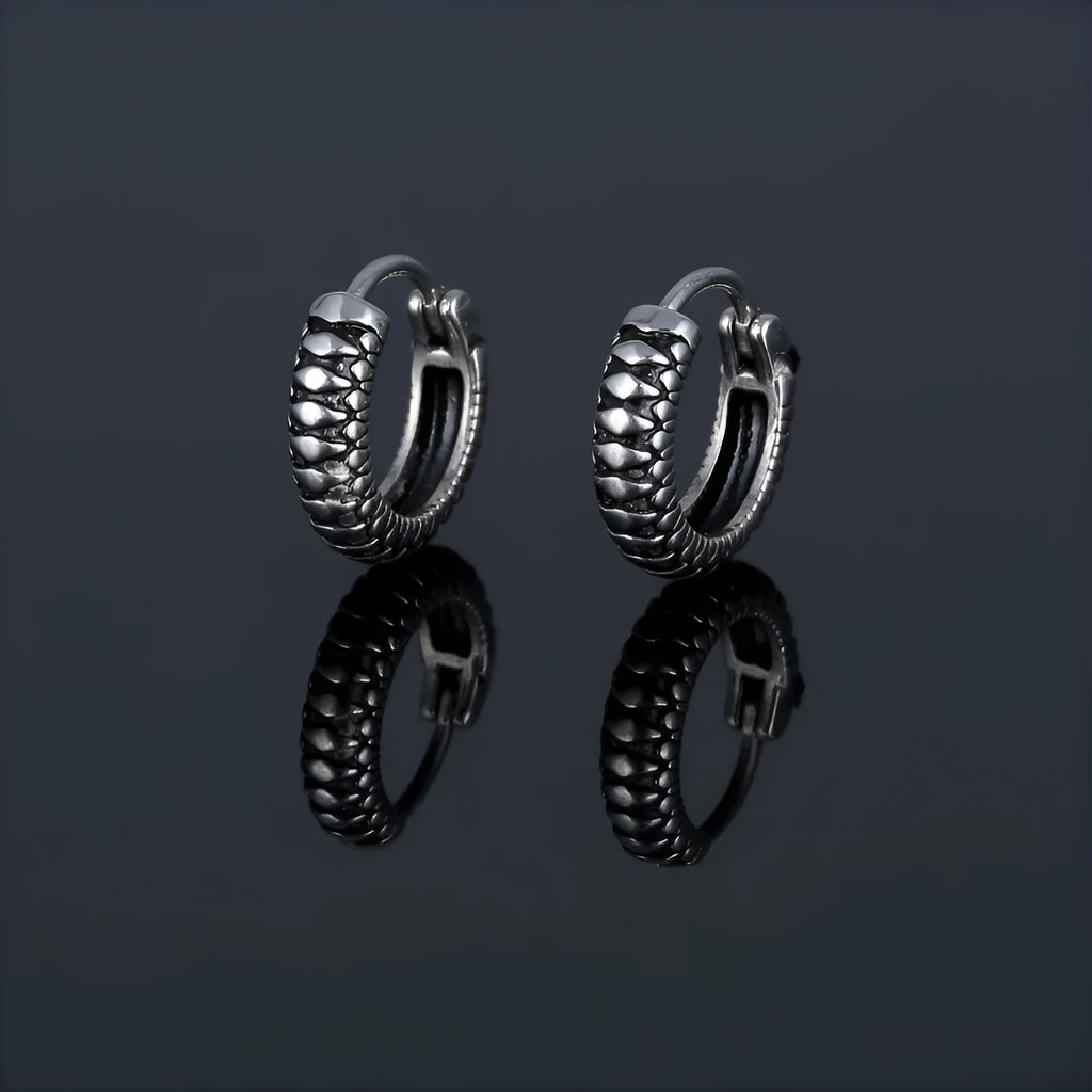 Silver geometric alloy earrings with a retro twist design and stainless steel stripes.