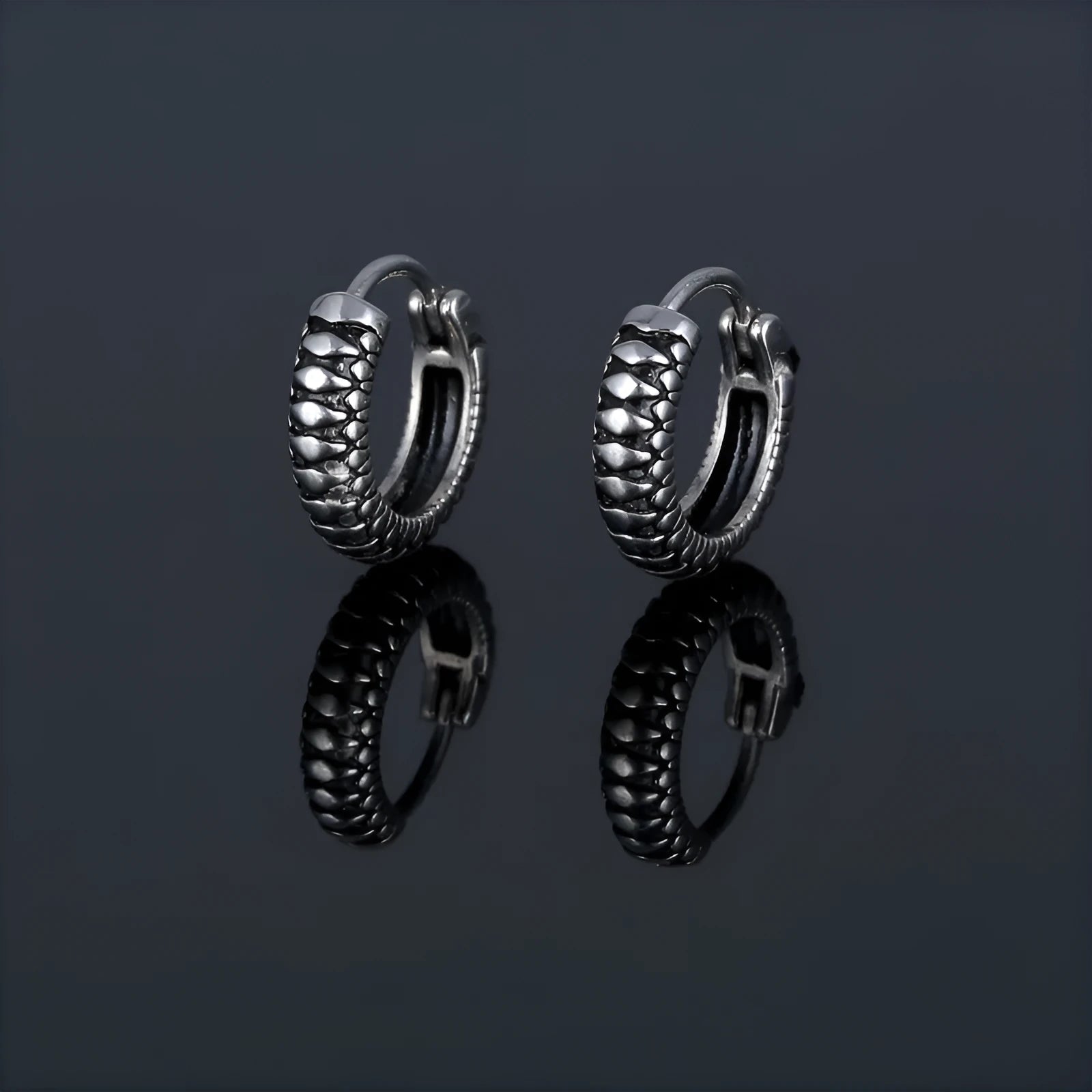 Silver geometric alloy earrings with a retro twist design and stainless steel stripes.