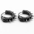 A pair of retro black alloy earrings with a geometry shape, designed with a punk motorcycle aesthetic.