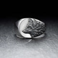 Men's silver wolf head alloy ring in geometric design on display