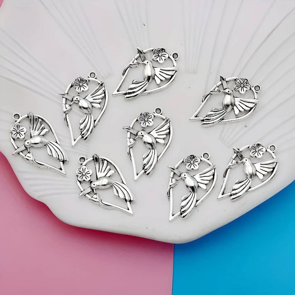 Alloy magpie bird pendant charm with electroplated finish on a white background.