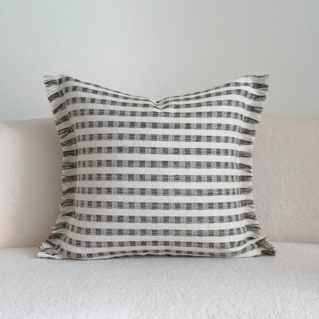 Coffee brown striped Chinese classical style sofa cushion on a living room sofa.