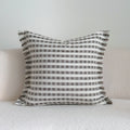 Coffee brown striped Chinese classical style sofa cushion on a living room sofa.