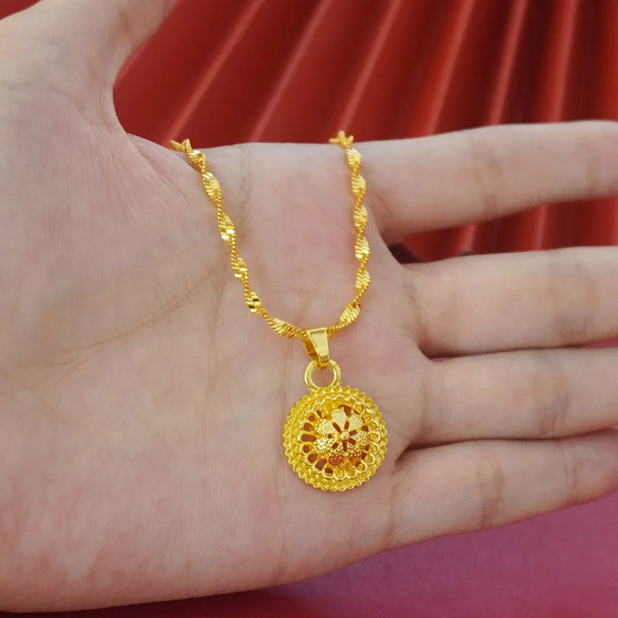 Gold electroplated three-piece jewellery set with floral designs, water wave chain necklace, matching earrings and ring