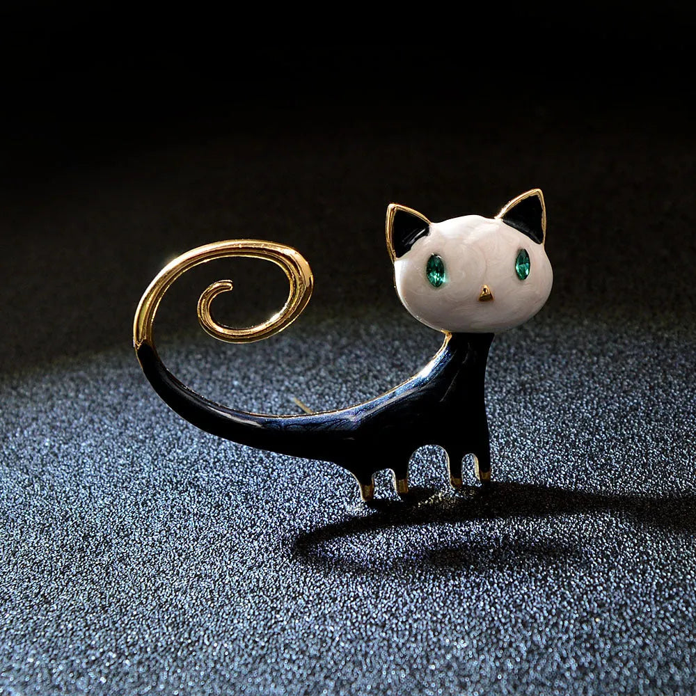 Personalised painted trailing up kitten brooch in alloy metal with white or orange colour options