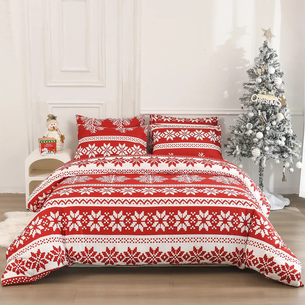 Red Winter Sleepers quilt cover and pillowcases with Christmas Love Song pattern on a bed.