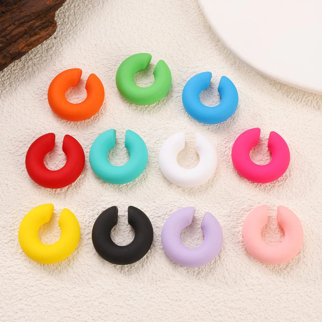 Matte finish C-shaped geometric clip-on earrings in assorted candy colours
