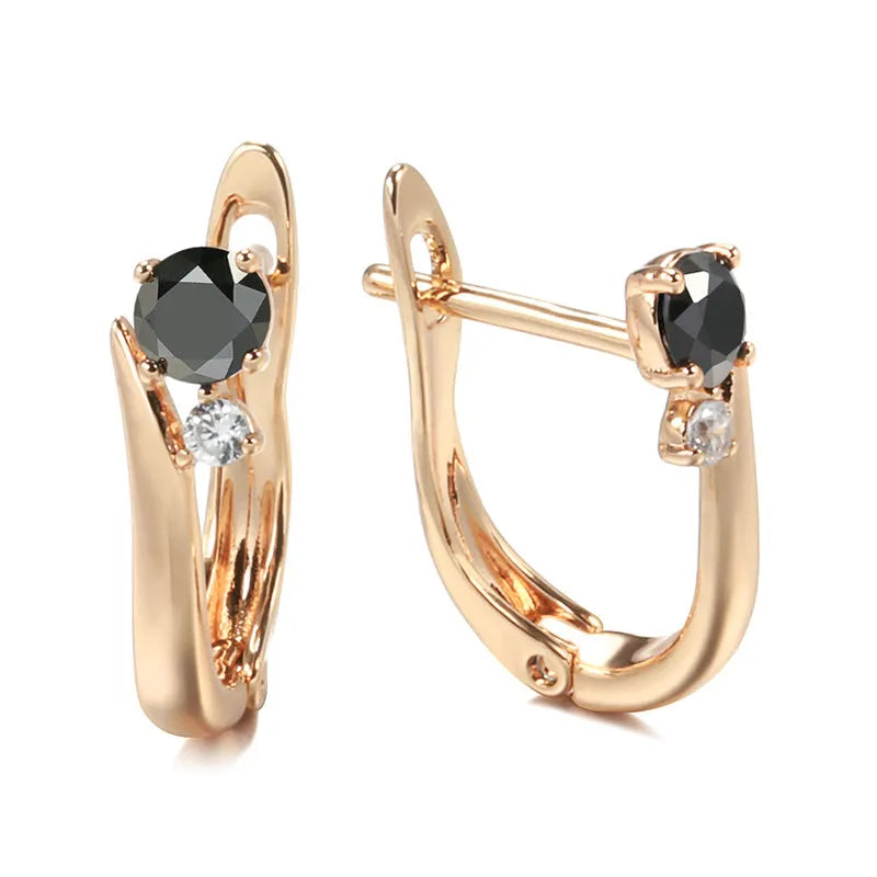 Gold geometric drop earrings with black agate stone styling