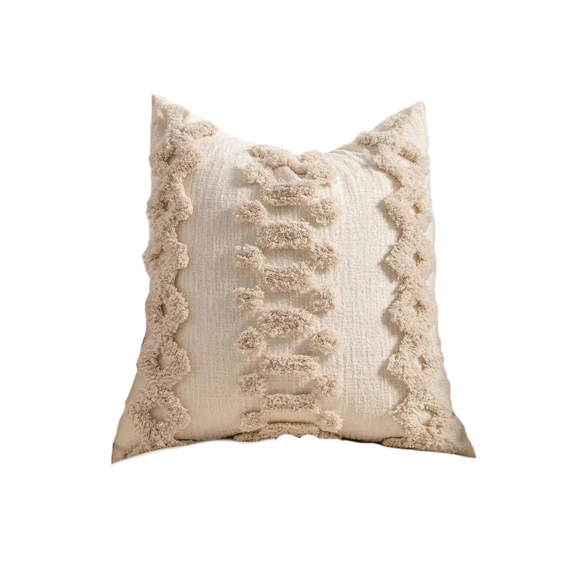 Knitted decorative pillow cover with tassels in a striped print design.