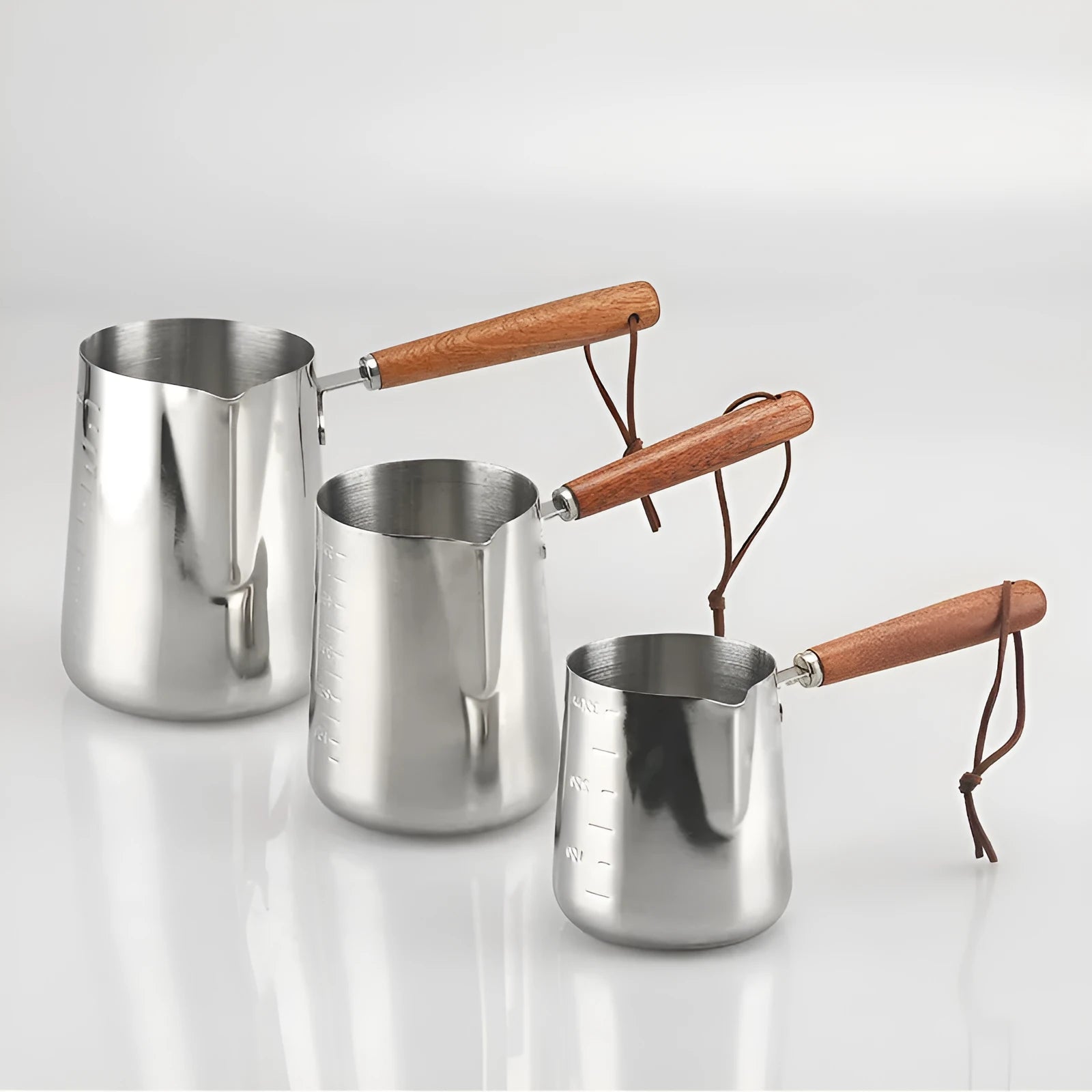 Stainless steel garland pattern coffee cup with a wooden handle in a simple modern style.