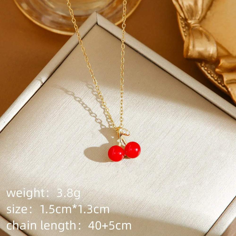 Titanium steel necklace with indie cherry, strawberry, and pepper motif pendant on an O-ring chain.