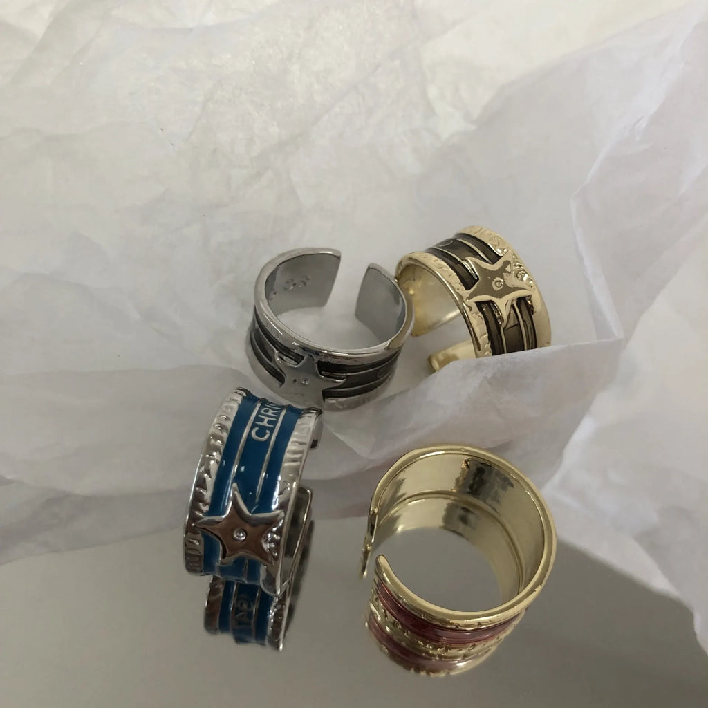 Adjustable geometric drop oil ring for women in copper with distressed finish and lines pattern