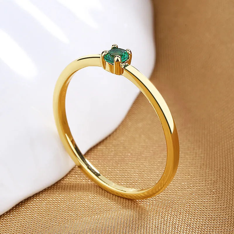 Twin Style women's geometric copper ring with a single diamond in a fine circle, shown in blue.