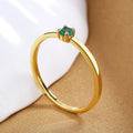 Twin Style women's geometric copper ring with a single diamond in a fine circle, shown in blue.