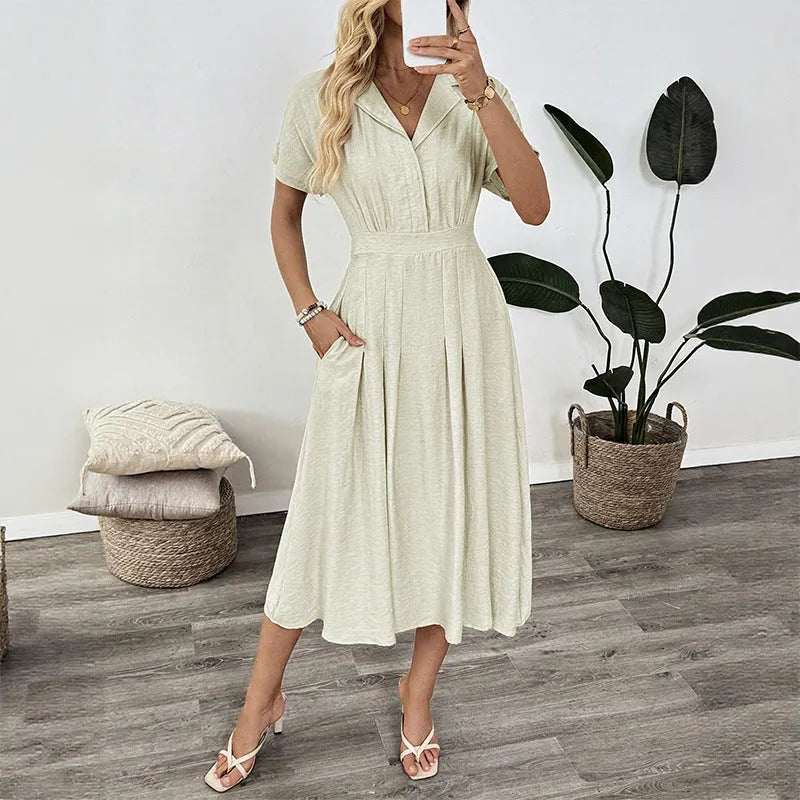 Light green women's twill shirt dress with lapel collar, fitted waist, and a chest pocket.