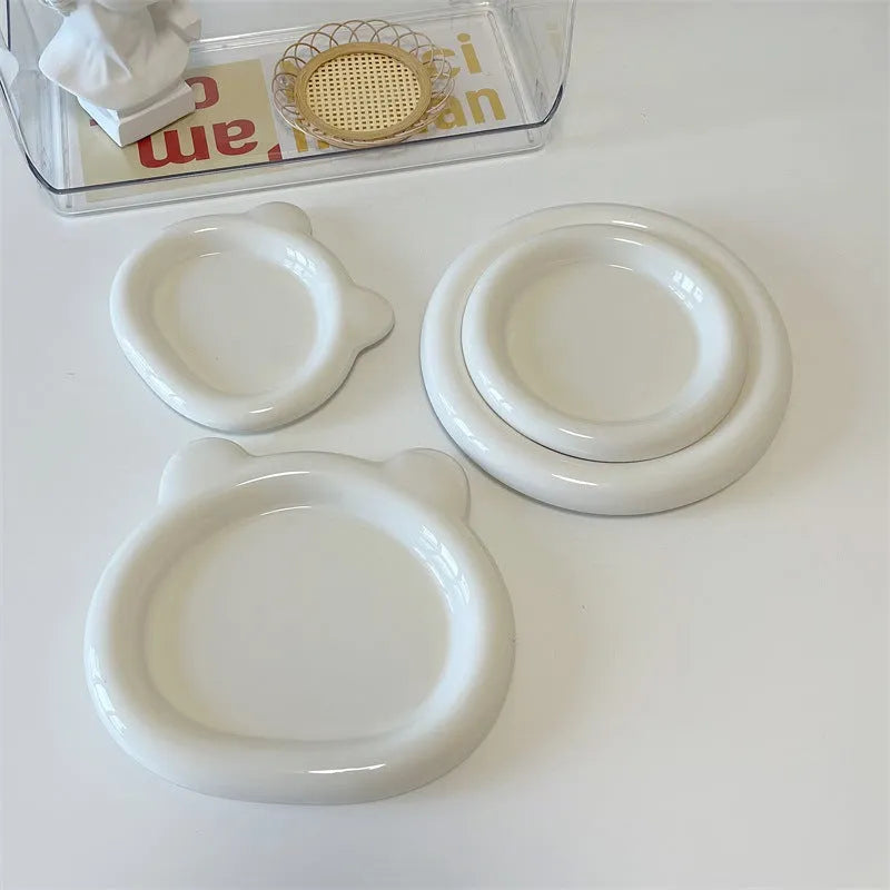 White ceramic ins-style plate with doodle design, shown in bear and round patterns in two sizes.