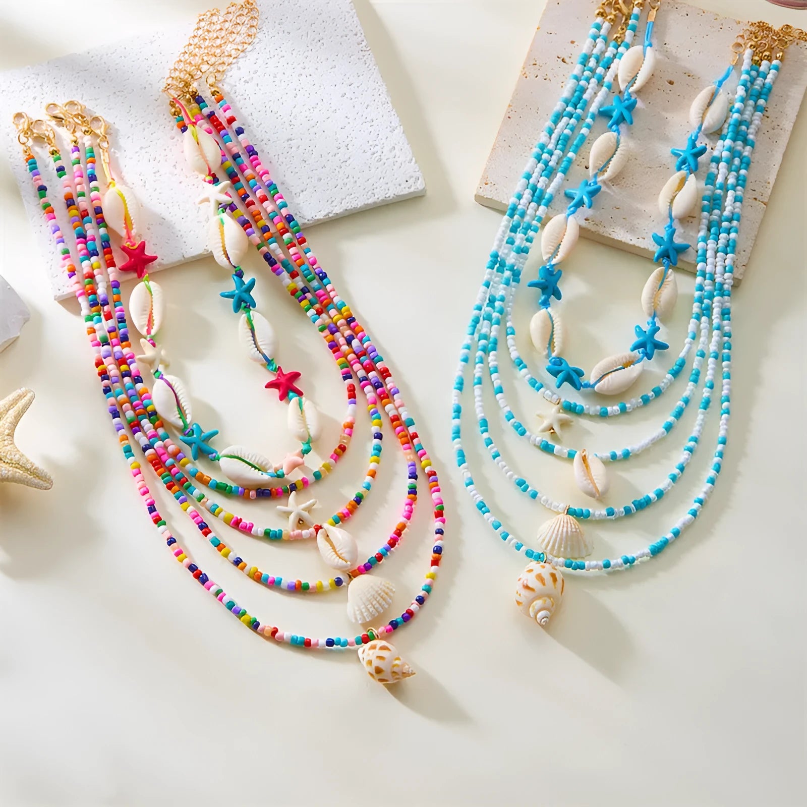 Blue and coloured women's summer necklace set with starfish, shell, and conch bead pendants on beaded chains