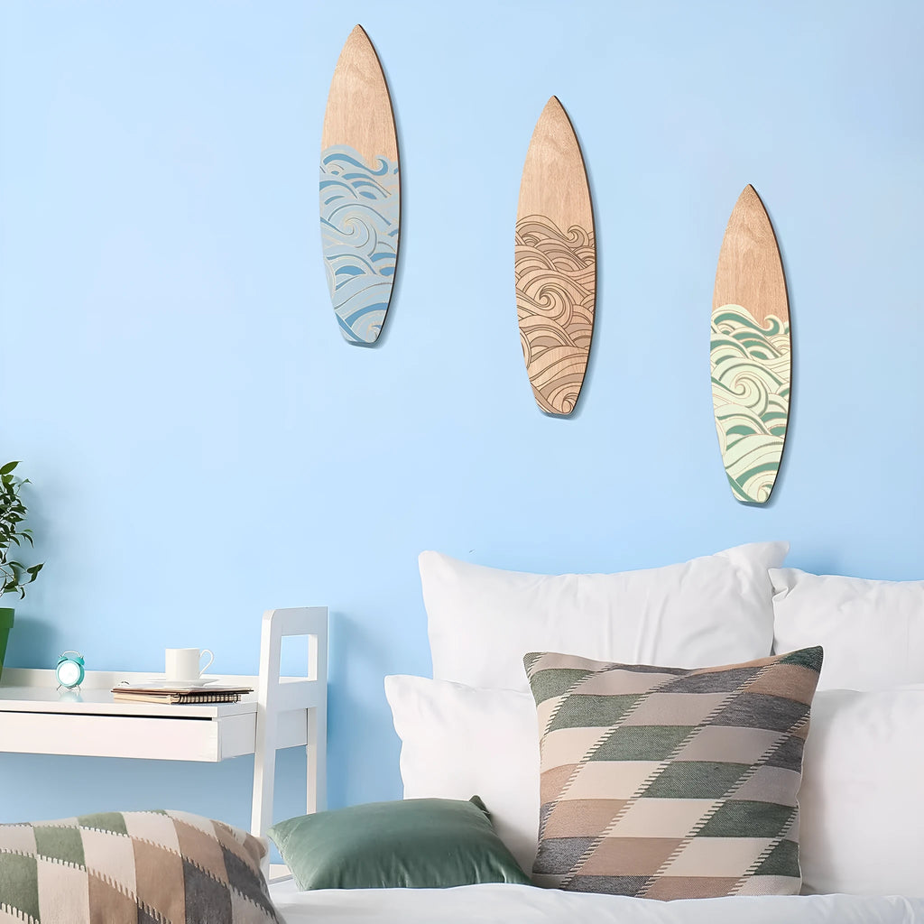 Three wooden surfboard-shaped wall decorations on a white background.