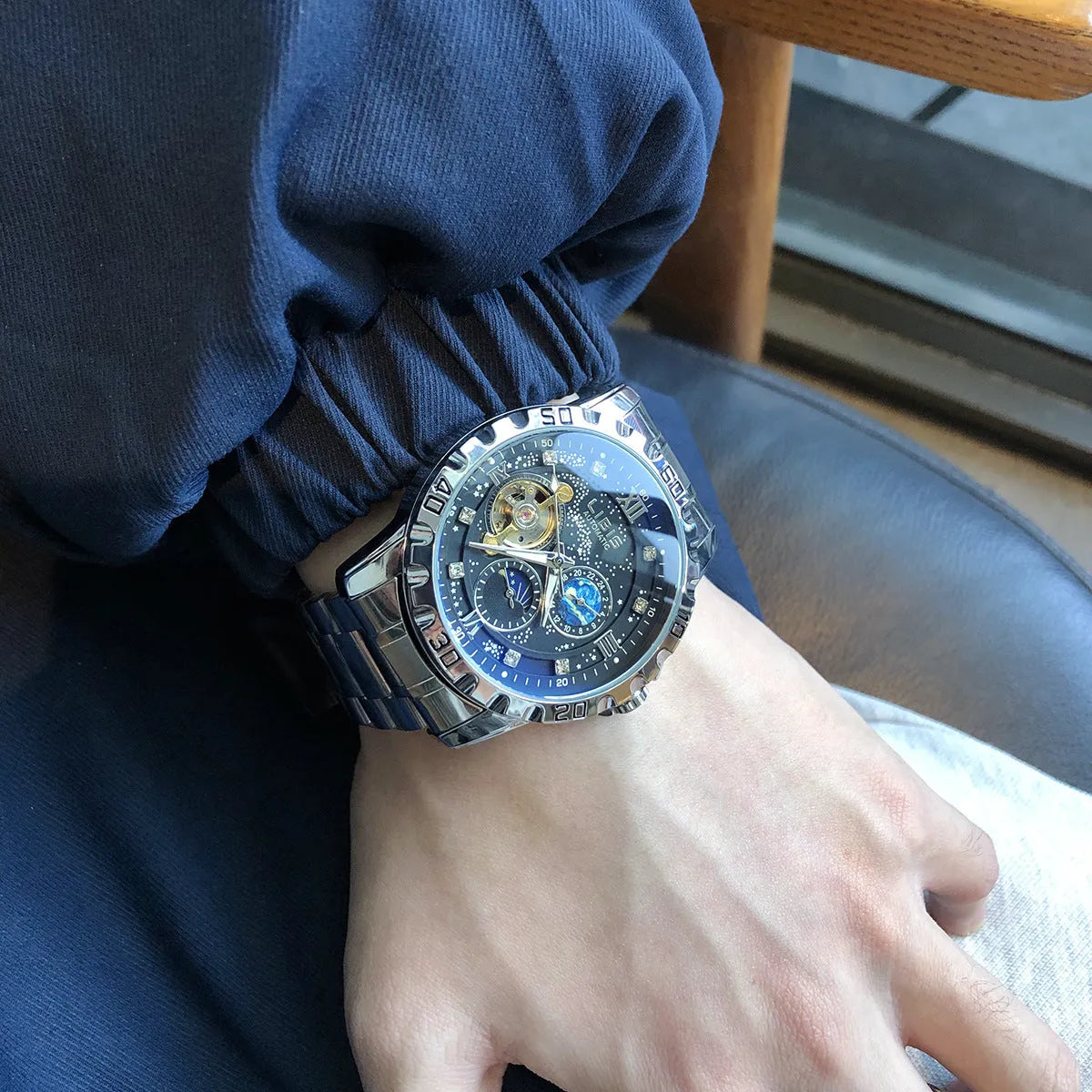 Men's silver mechanical watch with black starry dial and brown leather strap