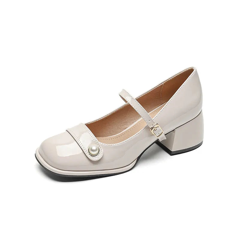 French-style women's chunky heel pumps with patent leather upper and buckle fastening