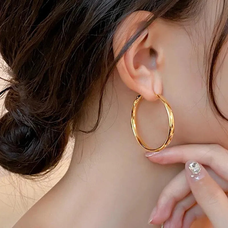 40mm diameter gold and silver metal circle hoop earrings on copper base
