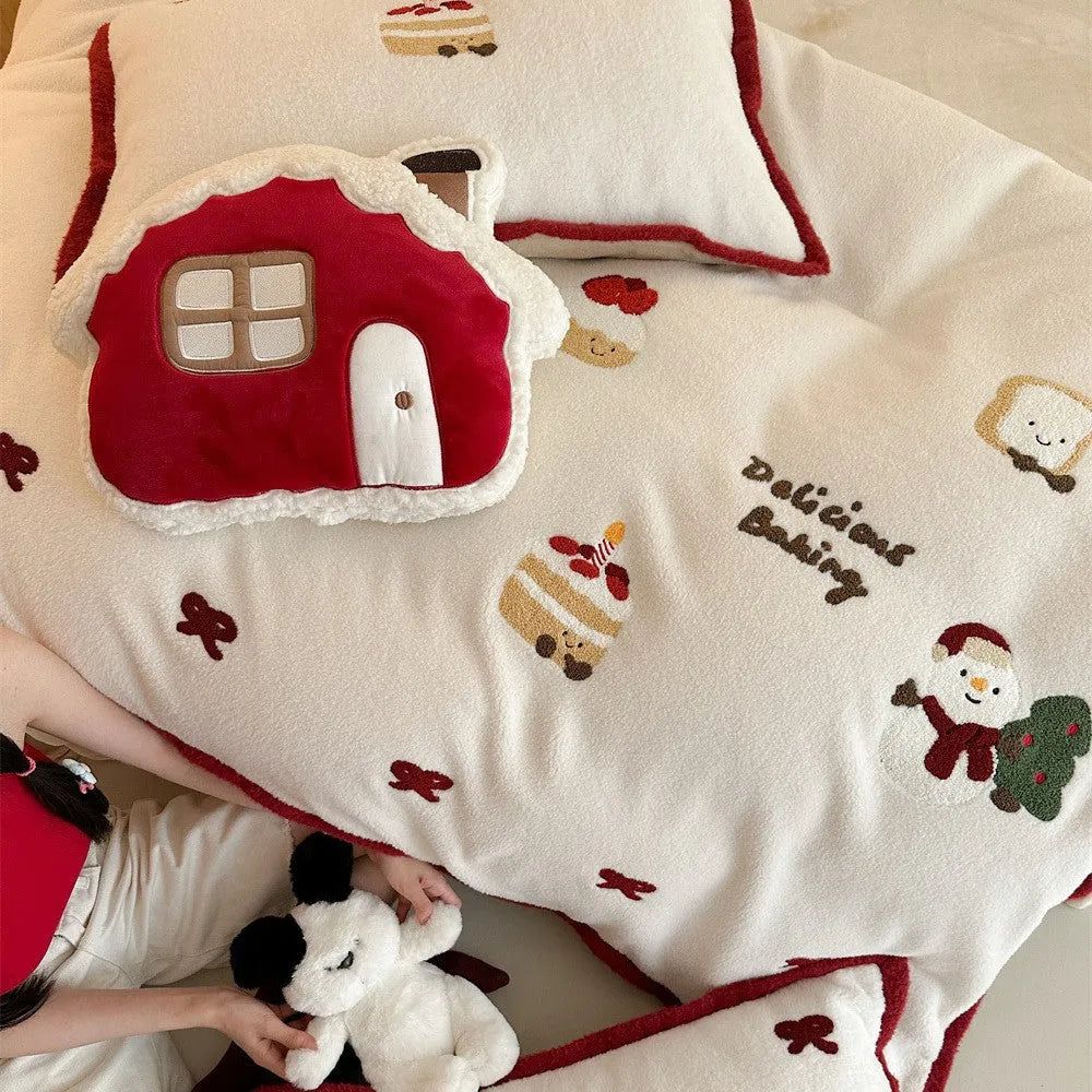 Girl's Heart cartoon pattern four-piece bedding set with winter Christmas theme on bed